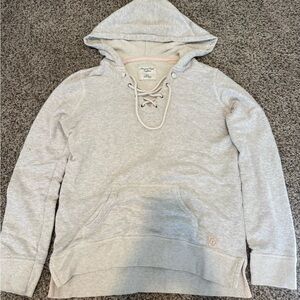 American Eagle Outfitters women's lace-up hoodie with pink stitching